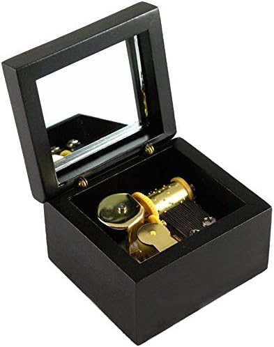קופסת מוזיקת ​​עץ מפותלת עם תנועת ציפוי זהב פנימה, נהר מון, שחור